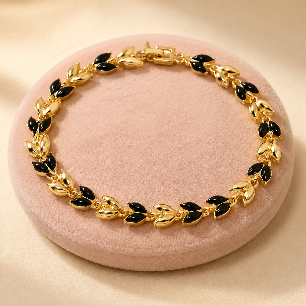 Sylvara gold bracelet with black marquise leaf stones