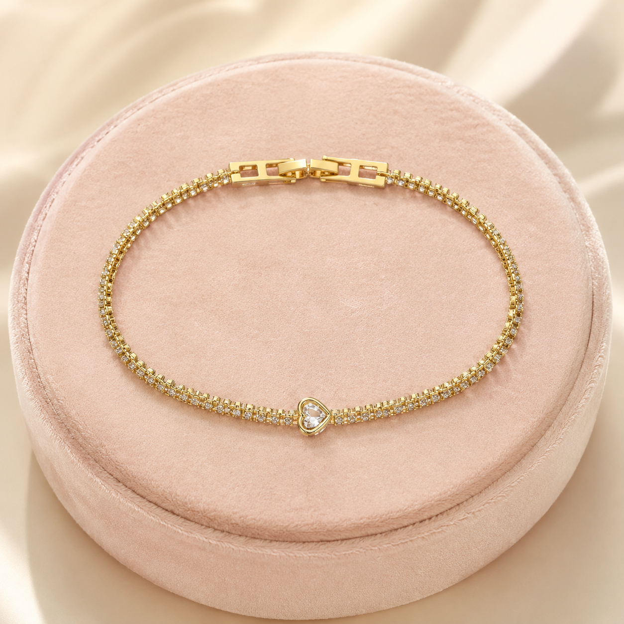 Celestia crystal heart tennis bracelet in gold finish
